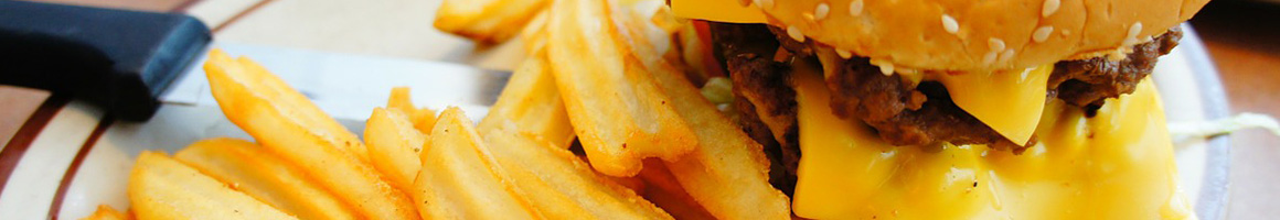 Eating Barbeque Burger at Peck's Bar B Que restaurant in Staunton, VA.